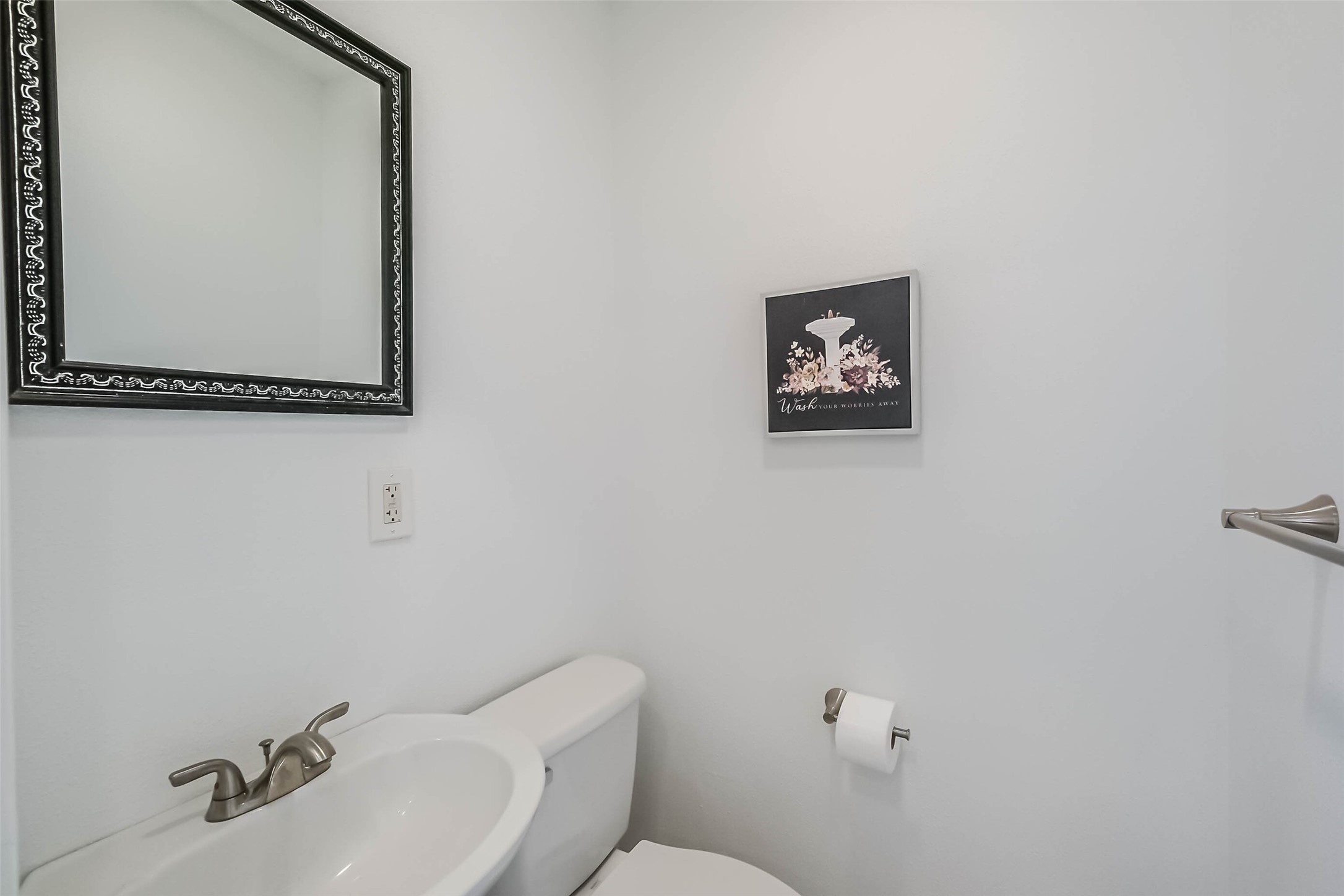 7543 Greenstone Street Houston, TX 77087 - Photo 5 of 24 a bathroom with a toilet sink and mirror