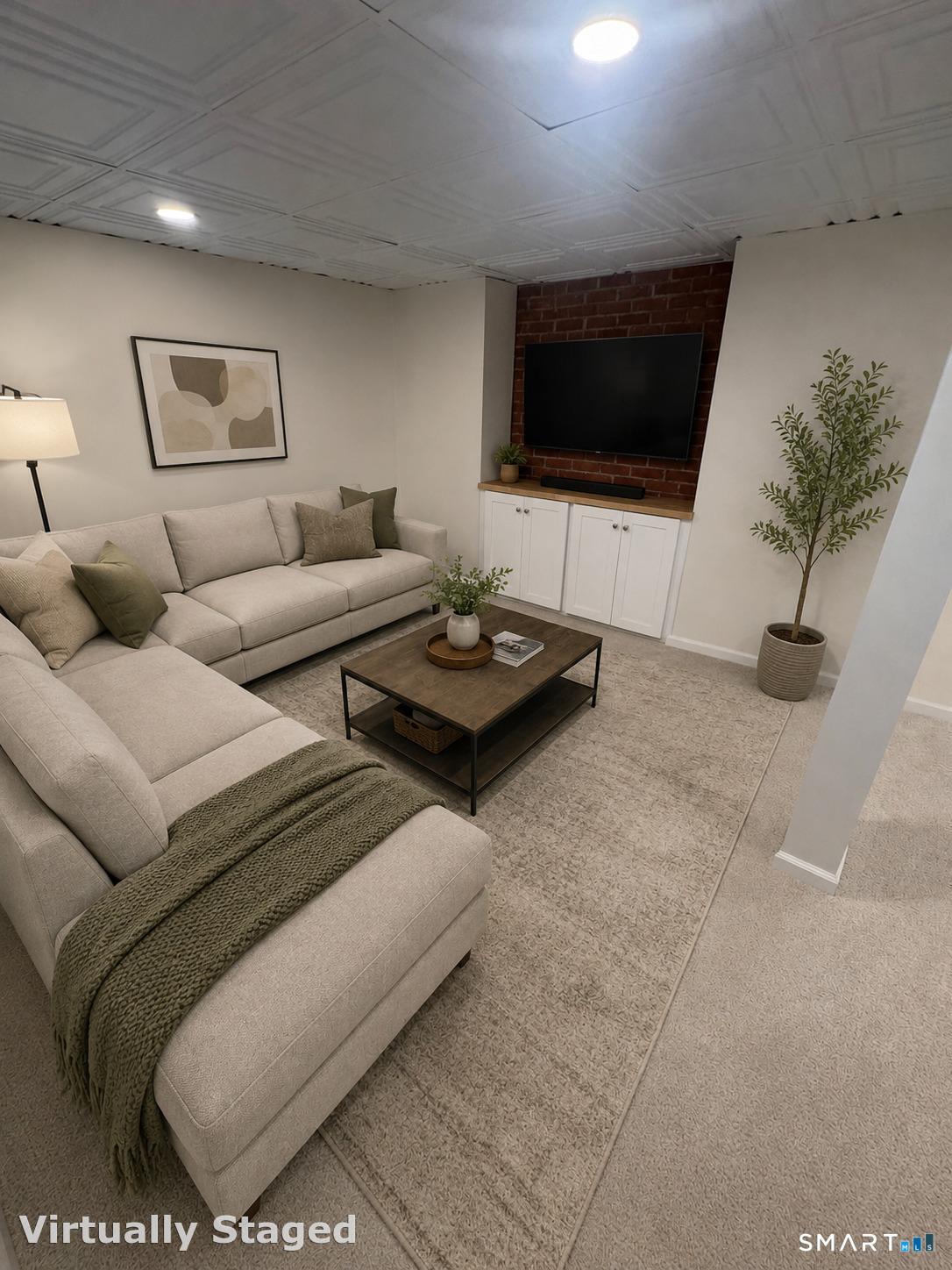 26 Ninety Rod Road Clinton, CT 06413 - Photo 19 of 27 a living room with furniture and a flat screen tv