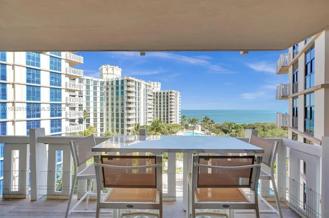 a view of a balcony with chair and table