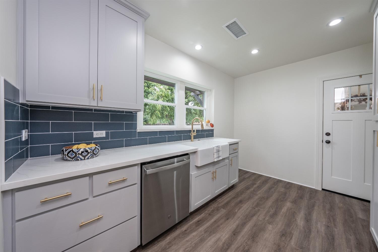 1600 West 5th Street Madera, CA 93637 - Photo 15 of 46 a kitchen with a sink cabinets and window