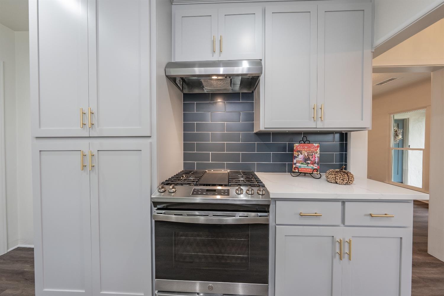 1600 West 5th Street Madera, CA 93637 - Photo 16 of 46 a stove top oven sitting inside of a kitchen
