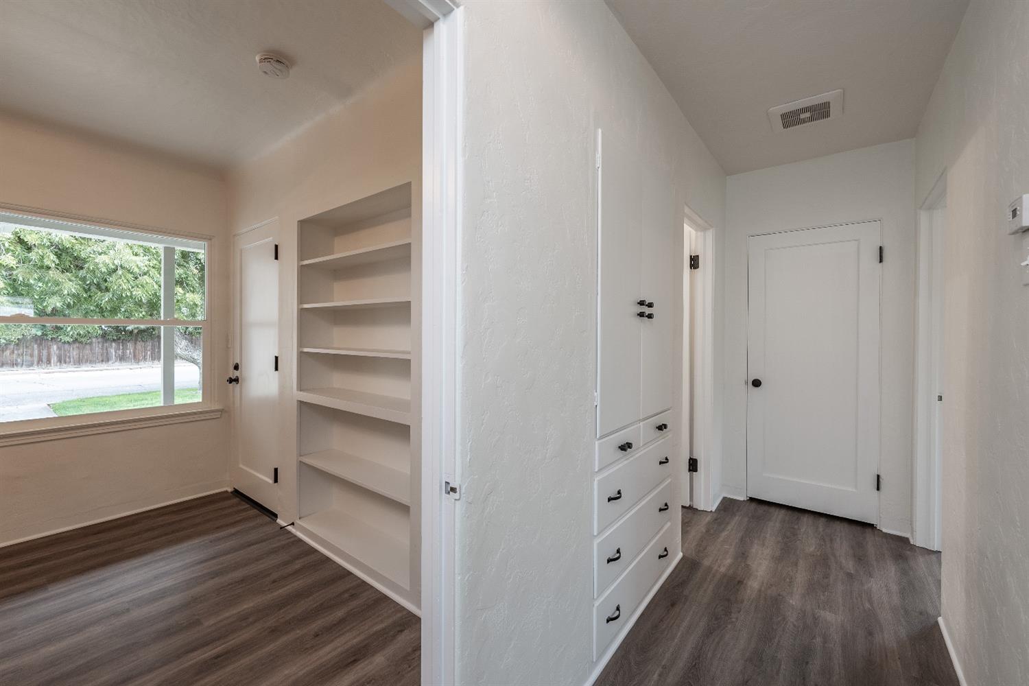 1600 West 5th Street Madera, CA 93637 - Photo 19 of 46 a view of empty room with wooden floor and fan