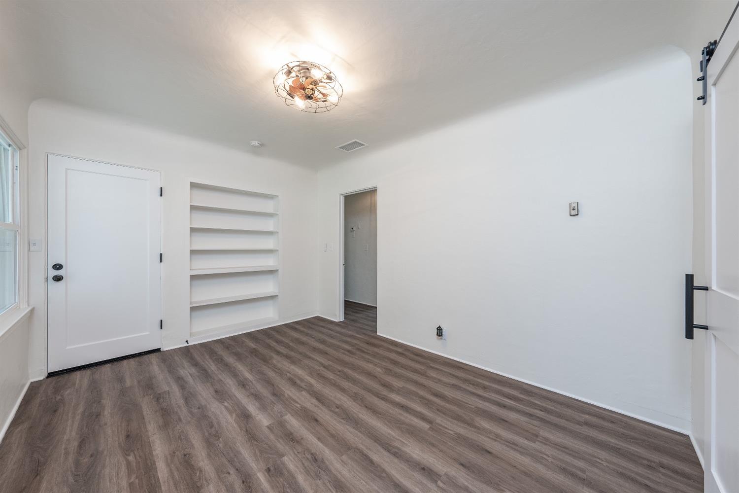 1600 West 5th Street Madera, CA 93637 - Photo 27 of 46 a view of empty room with wooden floor