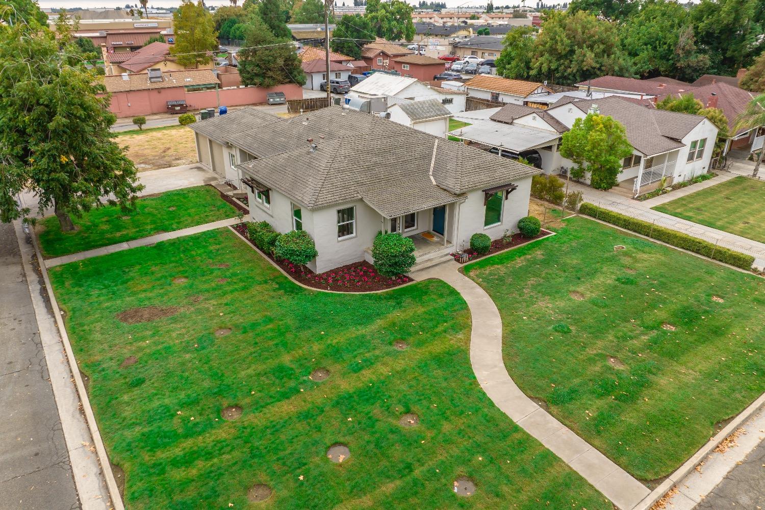 1600 West 5th Street Madera, CA 93637 - Photo 39 of 46 an aerial view of residential houses with outdoor space and trees