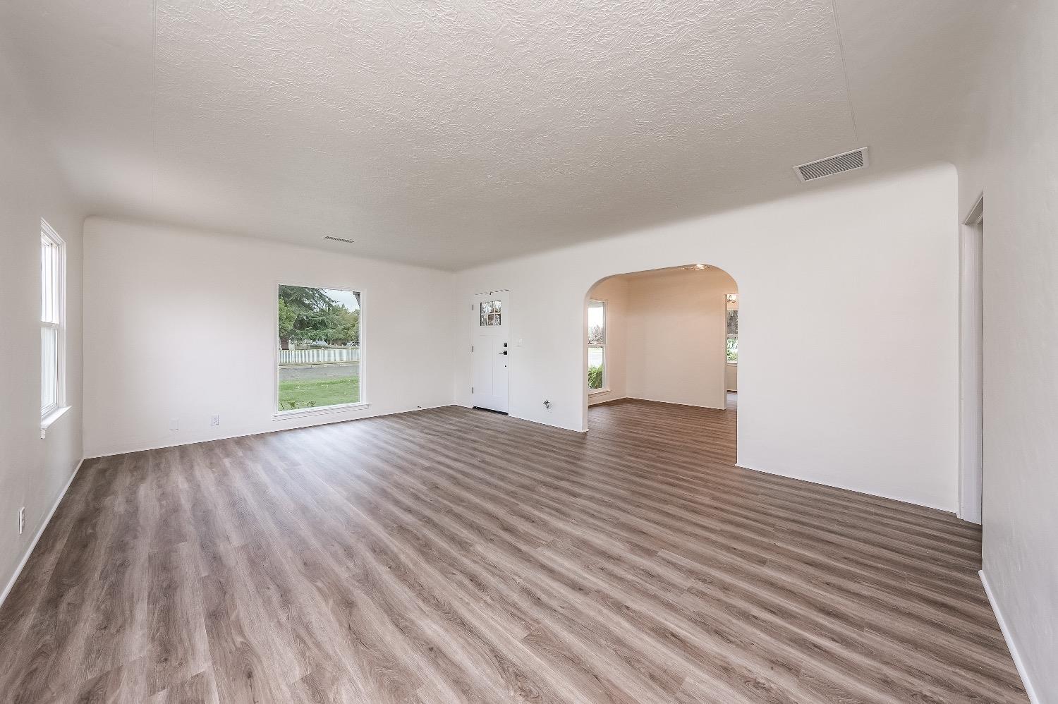 1600 West 5th Street Madera, CA 93637 - Photo 8 of 46 a view of empty room with wooden floor