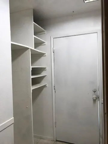 a view of an empty walk in closet