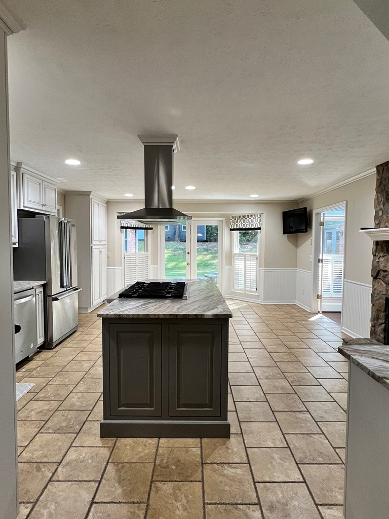 488 Blue Bird Trail Fortson, GA 31808 - Photo 19 of 45 a kitchen with kitchen island granite countertop a stove a sink and a refrigerator