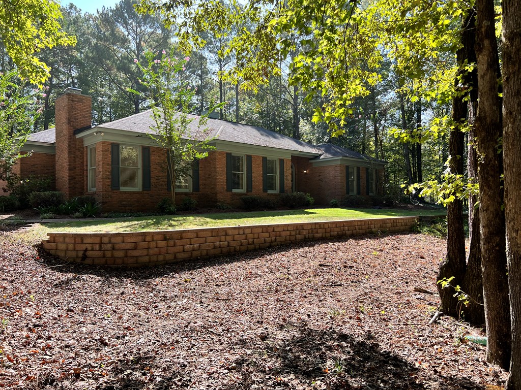 488 Blue Bird Trail Fortson, GA 31808 - Photo 2 of 45 a front view of a house with a garden