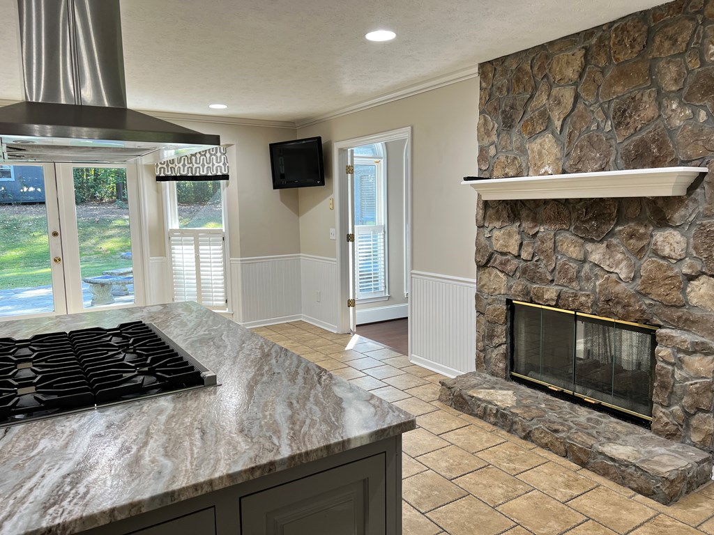 488 Blue Bird Trail Fortson, GA 31808 - Photo 22 of 45 a kitchen with granite countertop a stove and a refrigerator