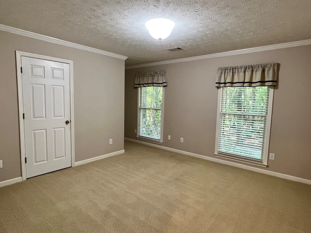 488 Blue Bird Trail Fortson, GA 31808 - Photo 31 of 45 an empty room with windows
