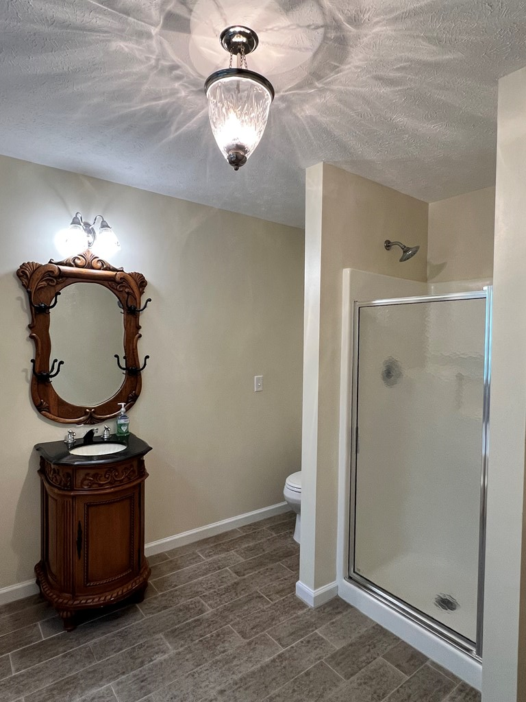 488 Blue Bird Trail Fortson, GA 31808 - Photo 34 of 45 a view of a hallway with wooden floor and entryway