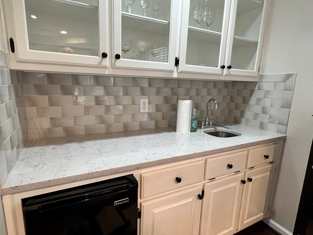 488 Blue Bird Trail Fortson, GA 31808 - Photo 40 of 45 a kitchen with a sink and cabinets