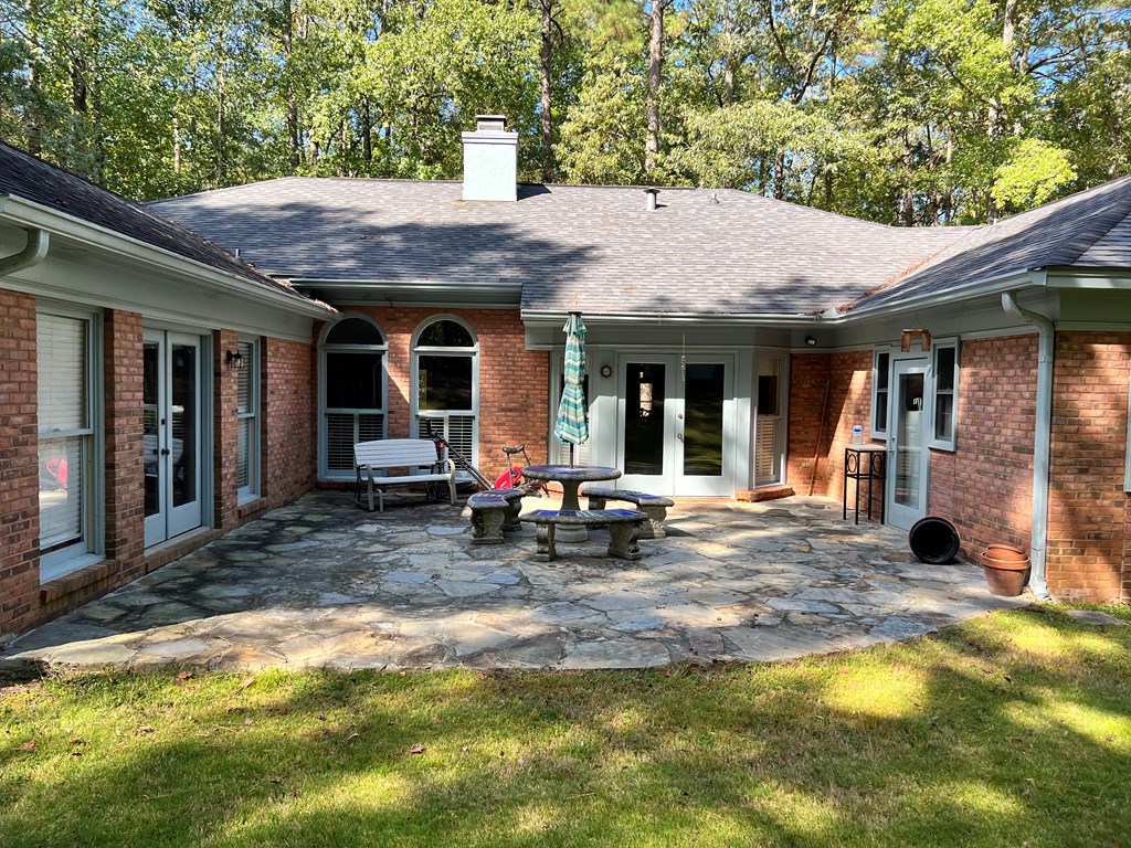 488 Blue Bird Trail Fortson, GA 31808 - Photo 41 of 45 a view of a house with patio area and small yard