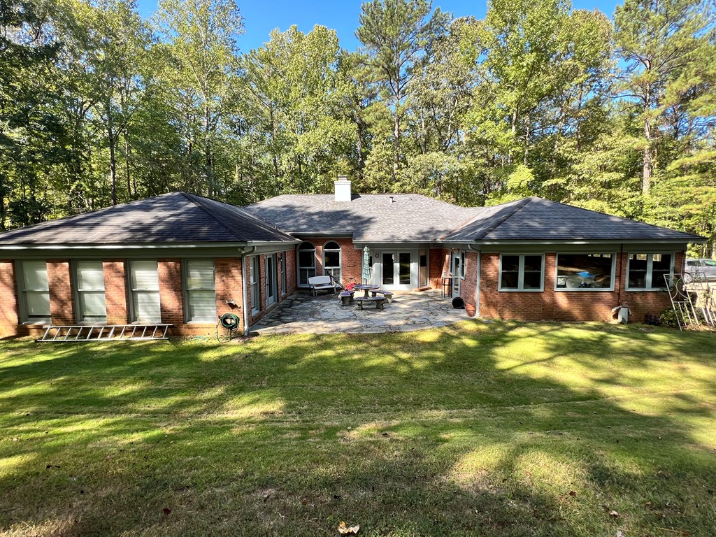 488 Blue Bird Trail Fortson, GA 31808 - Photo 42 of 45 a front view of a house with swimming pool having outdoor seating