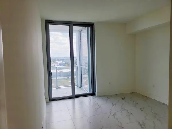 a bathroom with a toilet and shower