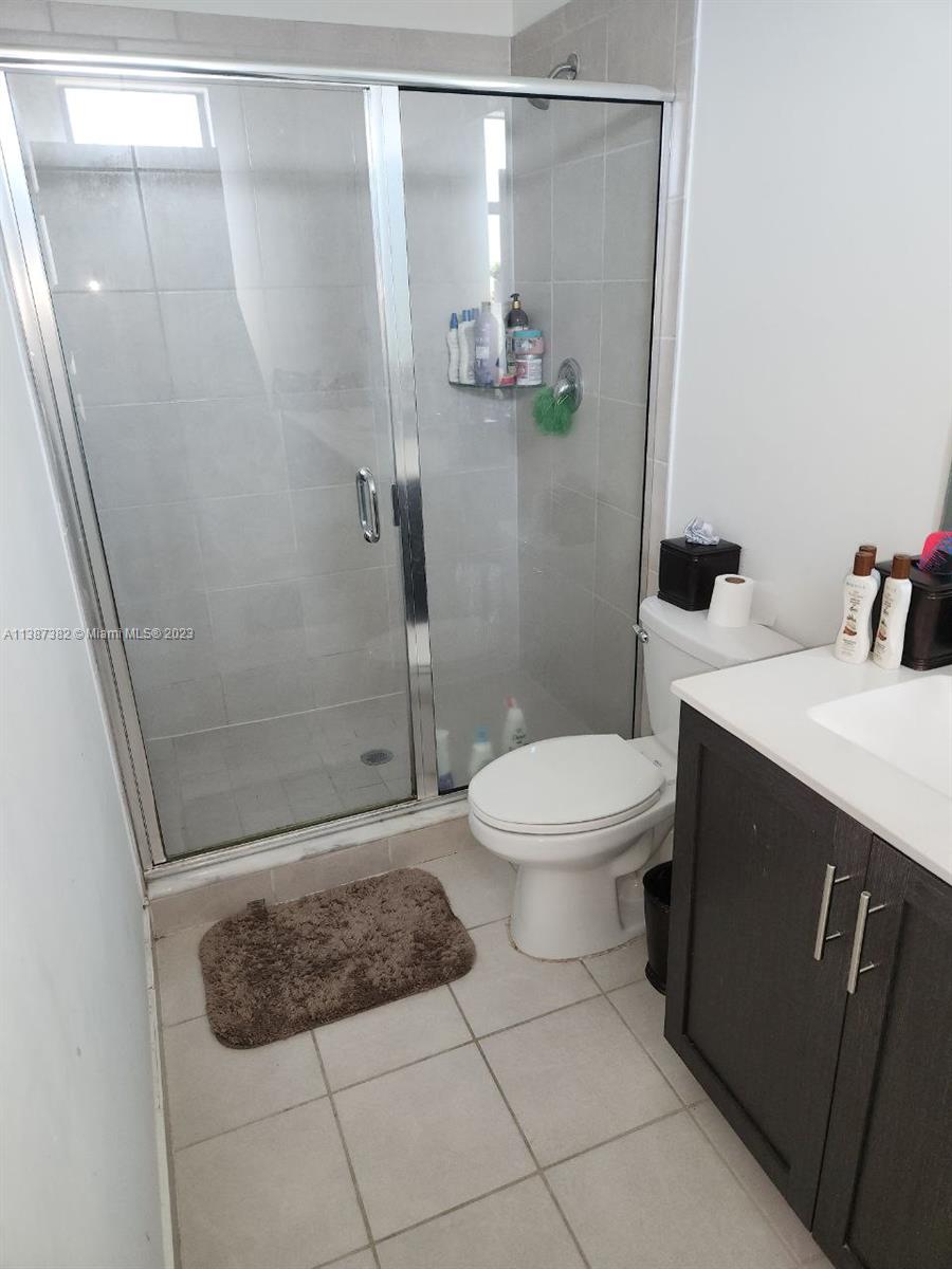 25151 Southwest 108th Court Homestead, FL 33032 - Photo 12 of 15 a bathroom with a toilet and a shower