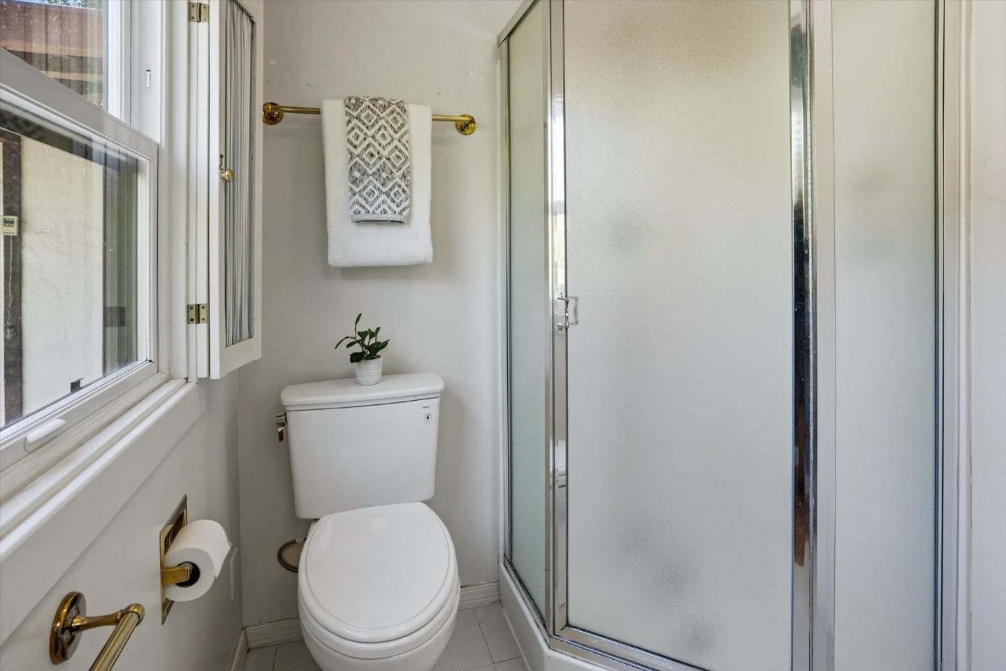 16899 Kennedy Road Los Gatos, CA 95032 - Photo 49 of 61 a white toilet sitting next to a bathroom sink