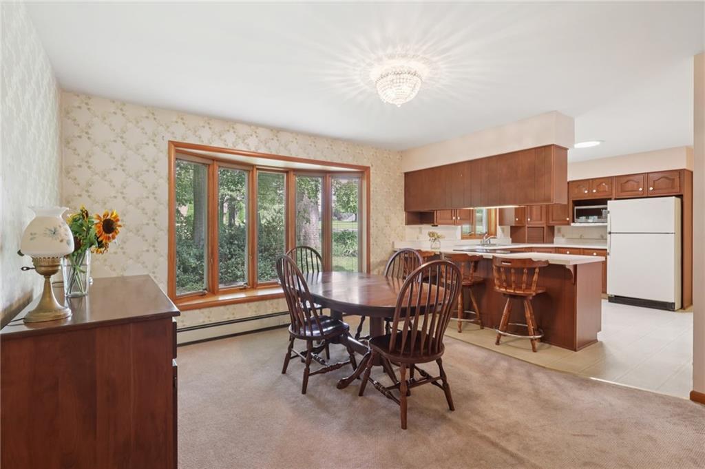 100 Joshua Drive Harmony, PA 16037 - Photo 14 of 39 a dining room with furniture and natural light