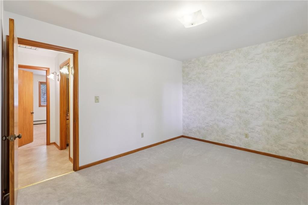 100 Joshua Drive Harmony, PA 16037 - Photo 20 of 39 an empty room with a bench