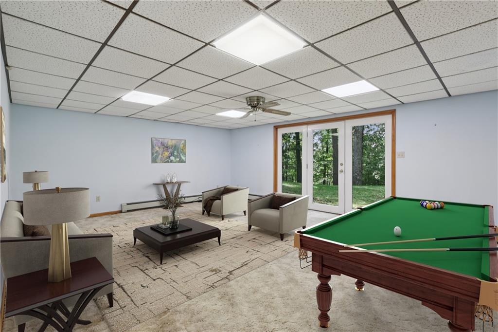 100 Joshua Drive Harmony, PA 16037 - Photo 25 of 39 a living room with furniture a table and a flat screen tv