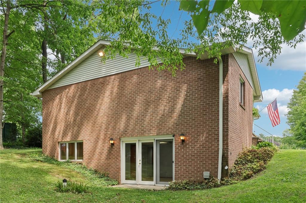 100 Joshua Drive Harmony, PA 16037 - Photo 31 of 39 a backyard of a house with lots of green space