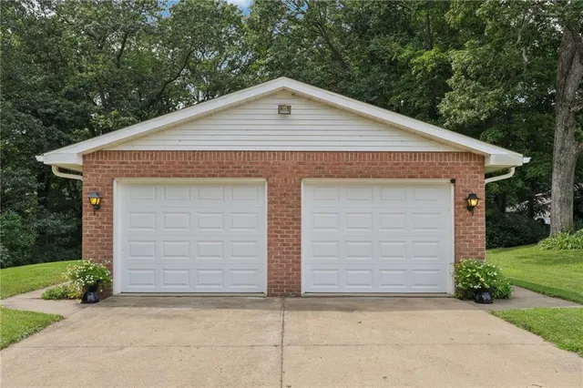 a front view of a house with garage