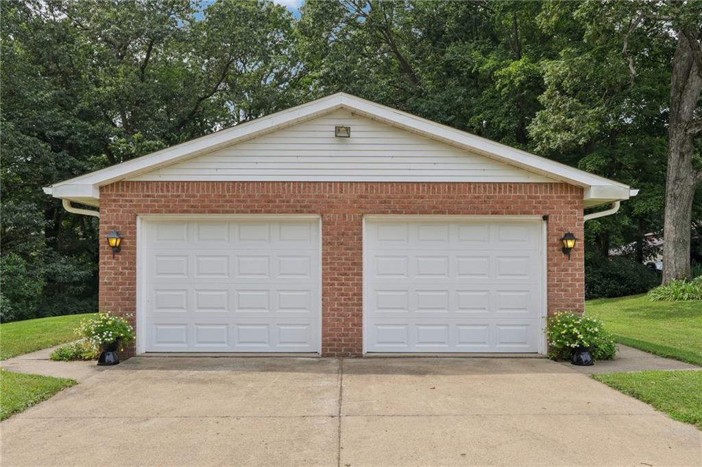 100 Joshua Drive Harmony, PA 16037 - Photo 4 of 39 a front view of a house with garage