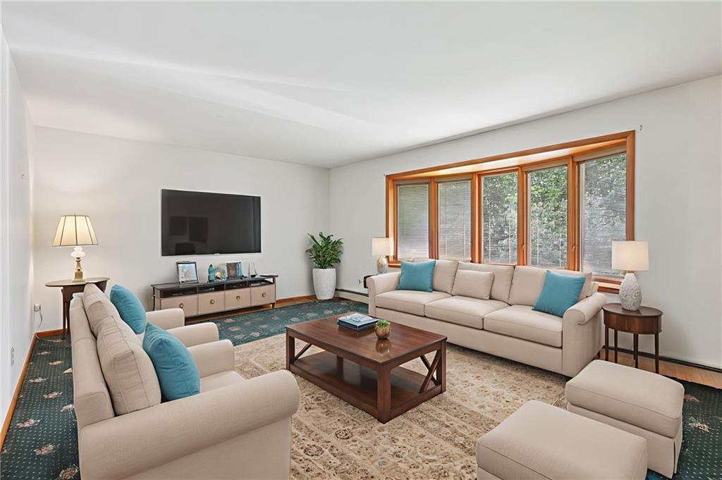 100 Joshua Drive Harmony, PA 16037 - Photo 8 of 39 a living room with furniture and a flat screen tv