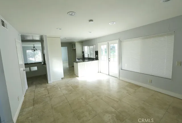 a view of a livingroom with a kitchen