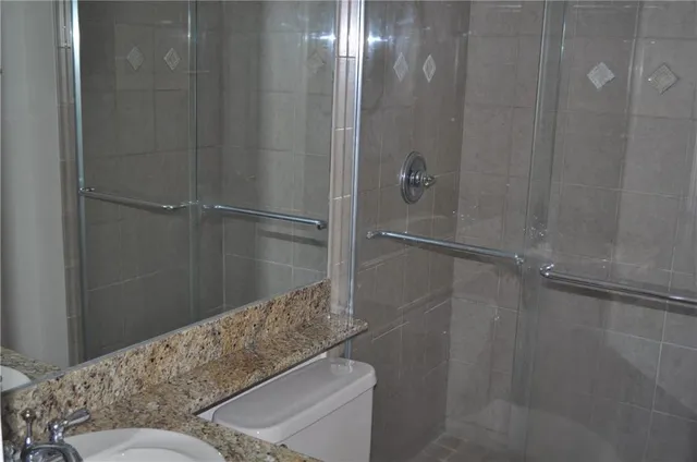 a bathroom with a shower and a toilet