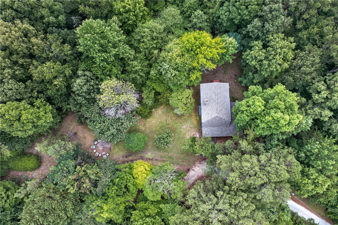 130 Maggie Rufus Lane Westminster, SC 29693 - Photo 41 of 50 Nestled amidst verdant woodlands, a secluded retreat offers private outdoor living and a tranquil escape.
