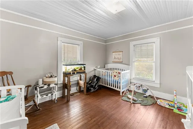 a bedroom with furniture and a window