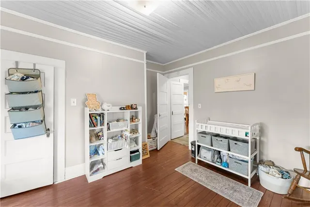 a view of a livingroom with wooden floor