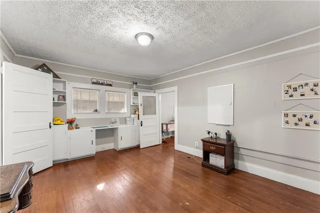 a view of utility room and bedroom