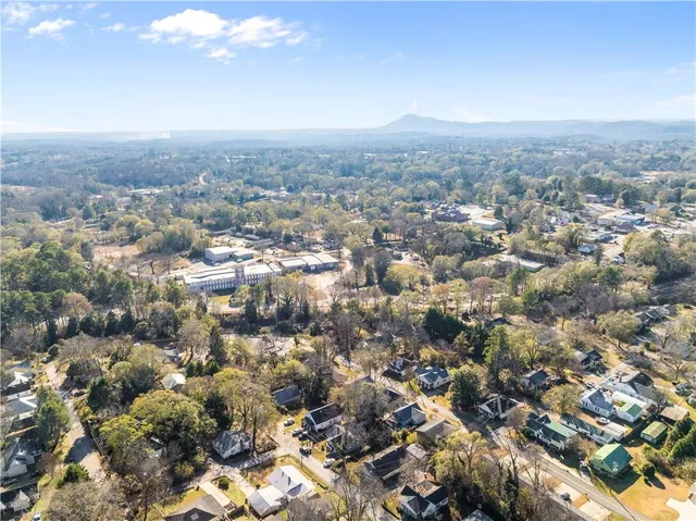 an aerial view of residential building with green space