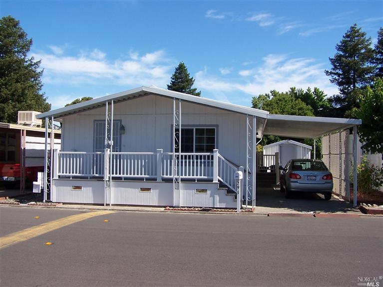 a view of a car park in front of house