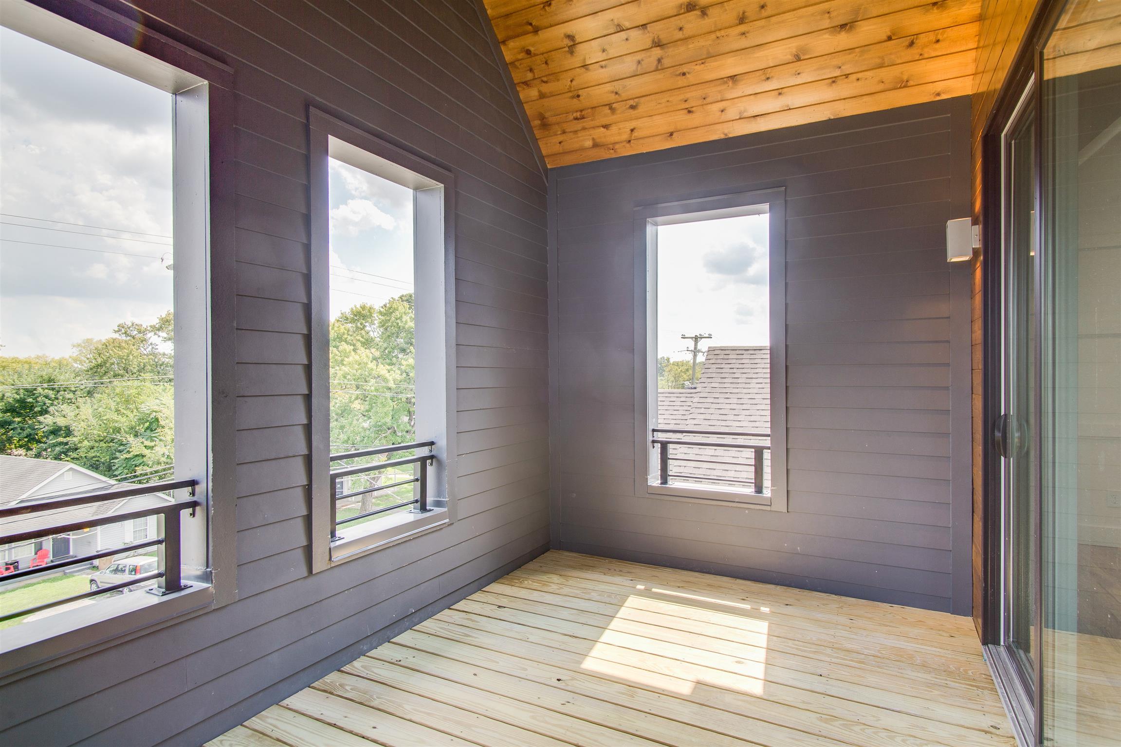119 A Rains Avenue Nashville, TN 37203 - Photo 19 of 25 a view of a house that has wooden floor and a window