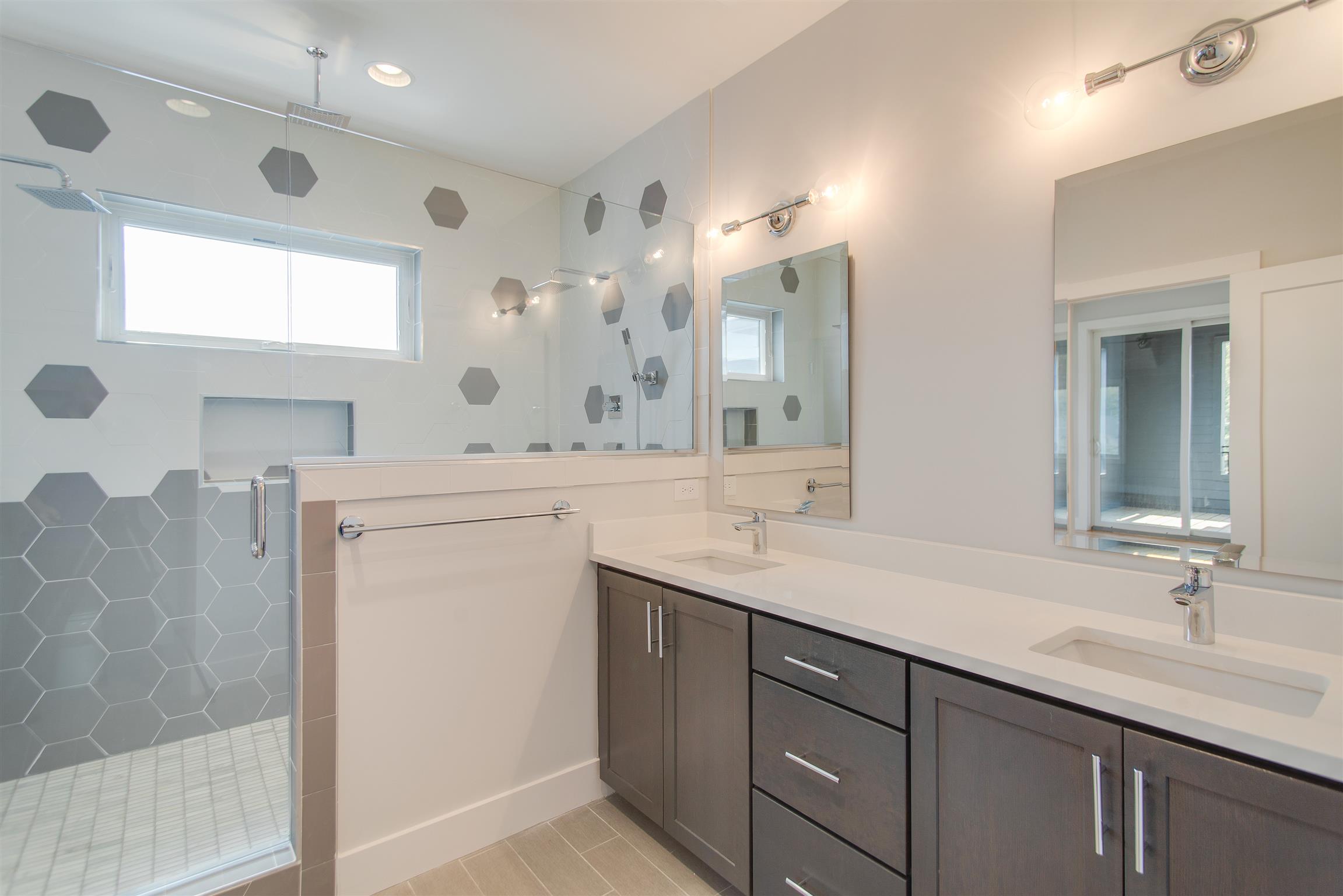 119 A Rains Avenue Nashville, TN 37203 - Photo 22 of 25 a bathroom with a double vanity sink mirror and double
