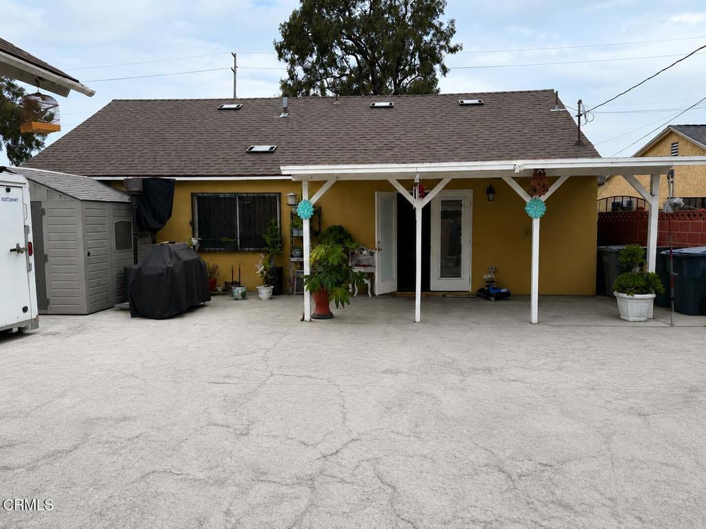 1214 South Ventura Road Oxnard, CA 93033 - Photo 6 of 7 a view of a house with a patio and a yard