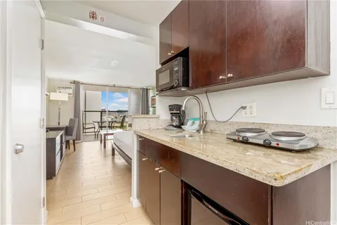 a kitchen with sink and cabinets