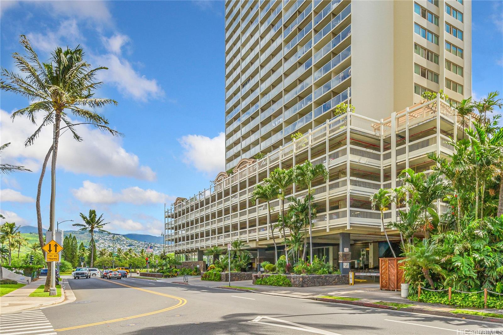 445 Seaside Avenue, Unit 2804 Honolulu, HI 96815 - Photo 19 of 25 a view of a tall building next to a road