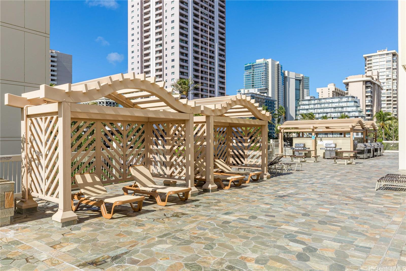 445 Seaside Avenue, Unit 2804 Honolulu, HI 96815 - Photo 23 of 25 a view of a terrace with chairs