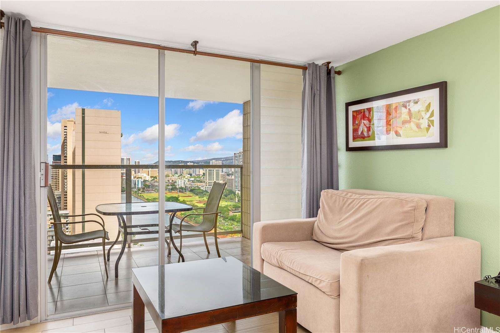 445 Seaside Avenue, Unit 2804 Honolulu, HI 96815 - Photo 6 of 25 a living room with furniture and a window