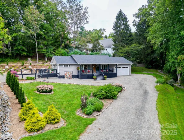 a view of a house with backyard sitting area and garden