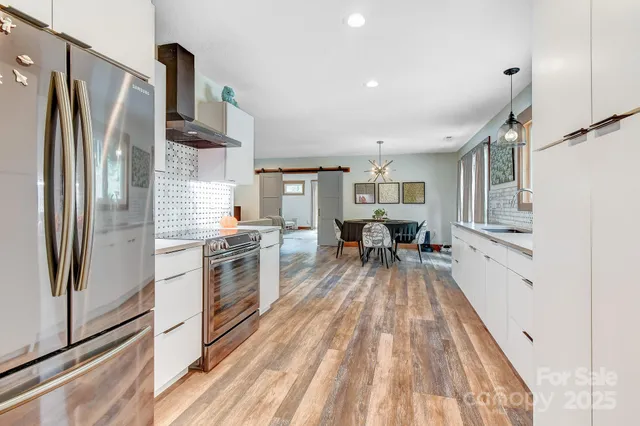 a kitchen with sink cabinets and stove