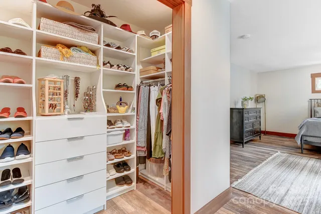 a bathroom with a sink a mirror and a shower