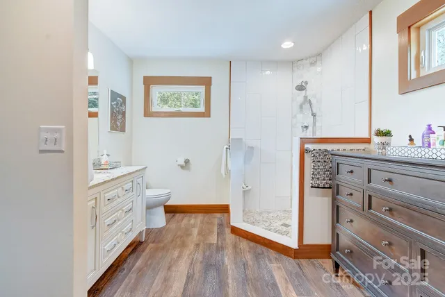 a view of a hallway with closet and window
