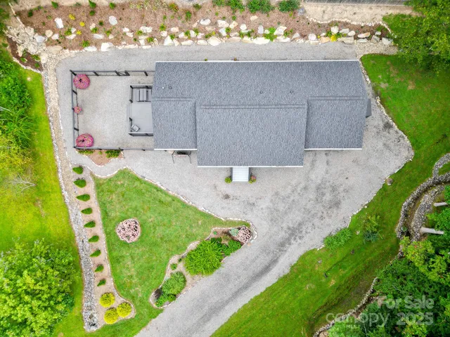 a dining room with furniture a chandelier and glass door