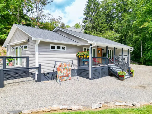 an aerial view of a house with a yard and a fountain