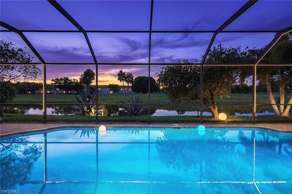 2227 Regal Way Naples, FL 34110 - Photo 21 of 34 Virtual Staged Pool at Twilght off the Living Room/Great Room